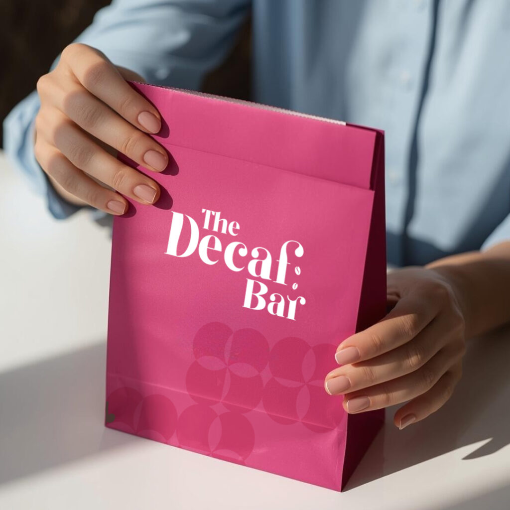 The Decaf Bar Pink Packaging Bag Mockup by Scribbled Space